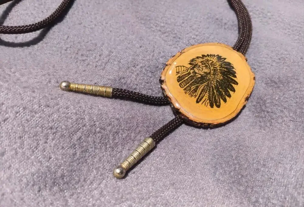 Vintage 1970s Bolo Tie Chief Engraved Wood Disc Brown Cord Brass Tips Western